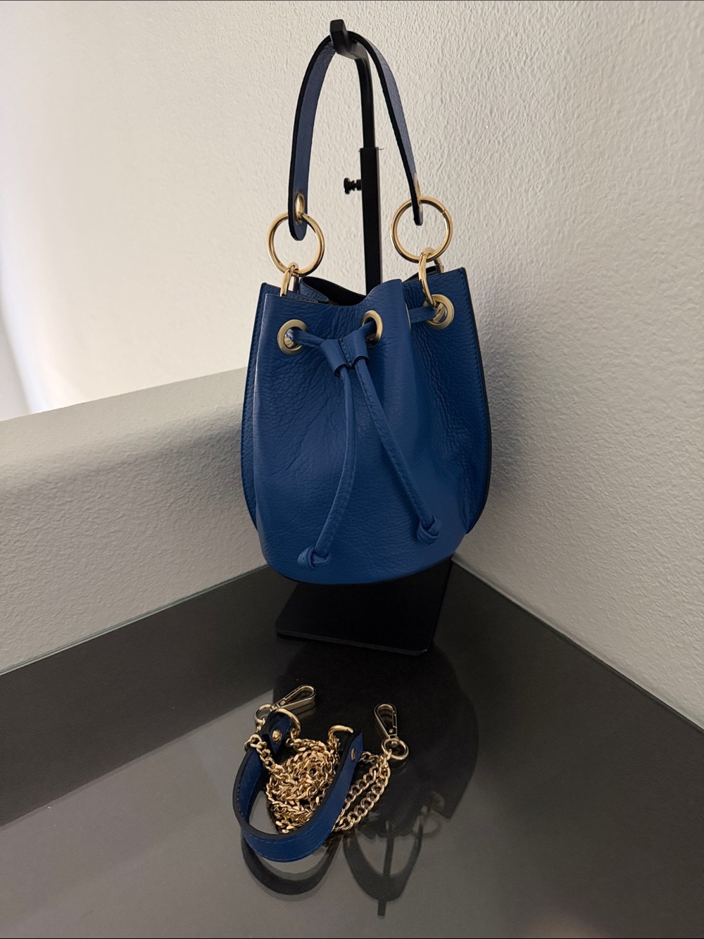 NWOT Bright Blue Leather Mini Bucket Bag with Gold Ring Hardware.